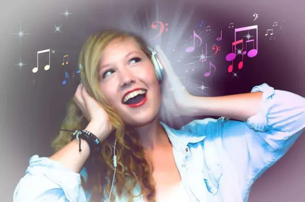 A Joyful Woman Wearing Headphones With Illustrated Music Notes And Colorful Effects Around Her, Suggesting She'S Enjoying Music.